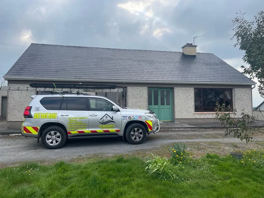 Weathered bungalow roof with the Flaherty 4x4 parked outside, Flaherty Roof and Driveways