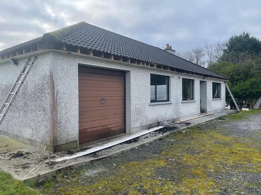 Bungalow and garage with new white fascia and gutters, Flaherty Roof and Driveways