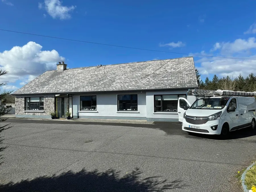 Bungalow roof before cleaning, weathered grey, with the Flaherty van outside, Flaherty Roof and Driveways