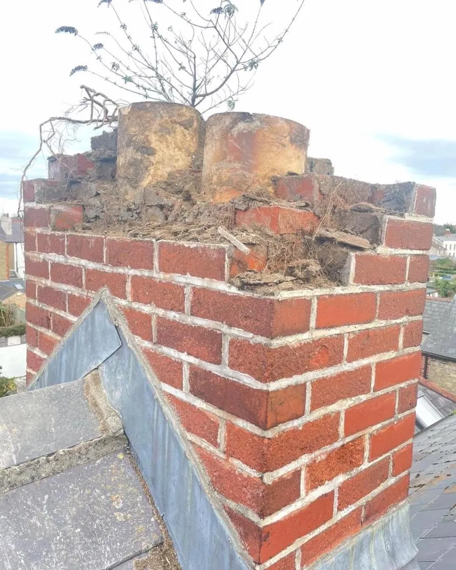 Crumbling brick chimney before it was rebuilt, Flaherty Roof and Driveways