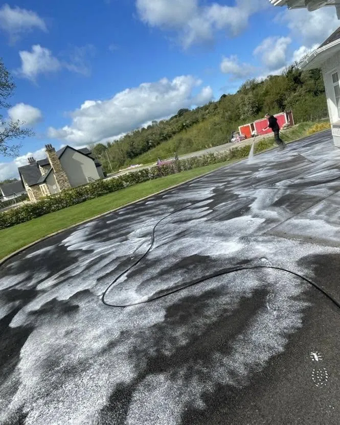 Driveway being power washed, Flaherty Roof and Driveways
