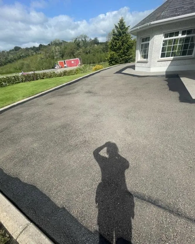 Sealed driveway in front of a bungalow, Flaherty Roof and Driveways