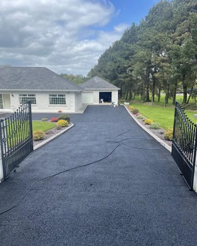 Driveway after cleaning and sealing, through the gates, Flaherty Roof and Driveways