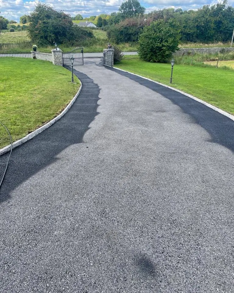 Long tarmac driveway through a country garden, Flaherty Roof and Driveways