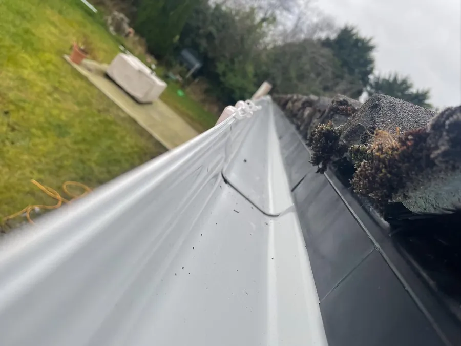 New white uPVC gutter run fitted at the eaves, Flaherty Roof and Driveways
