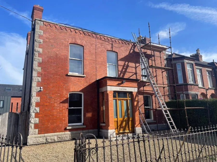 Red-brick town house with ladders up for roof and lead work, Flaherty Roof and Driveways