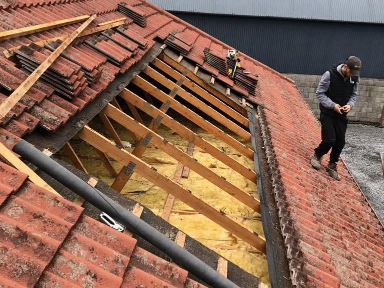 Red tile roof stripped back to the rafters, Flaherty Roof and Driveways