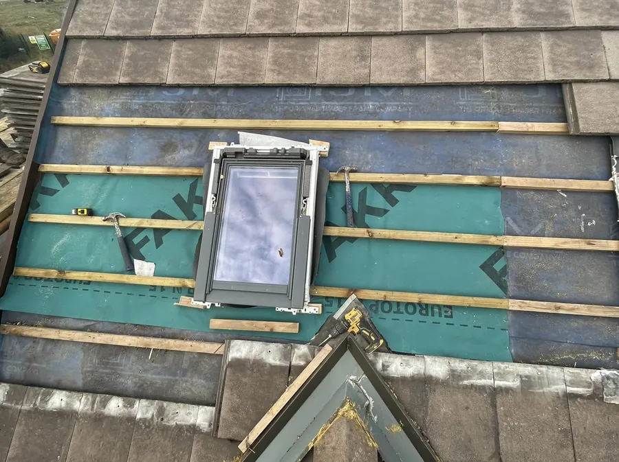 Roof window set into new membrane and battens on a re-roof, Flaherty Roof and Driveways