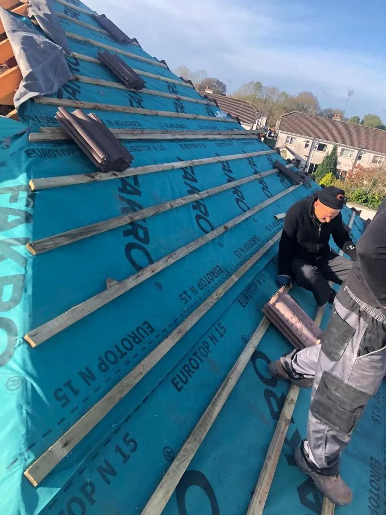 Roofer fixing battens over new breathable membrane, Flaherty Roof and Driveways