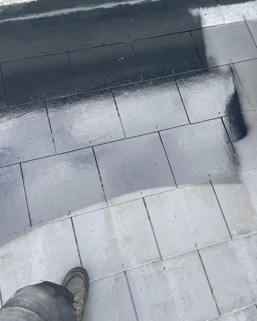 Slates mid-clean, the treated section beside the untreated, Flaherty Roof and Driveways