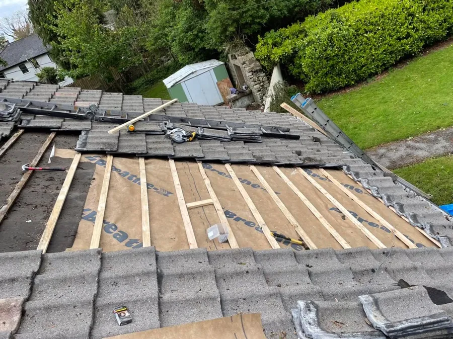Section of tiled roof stripped back to new battens, Flaherty Roof and Driveways