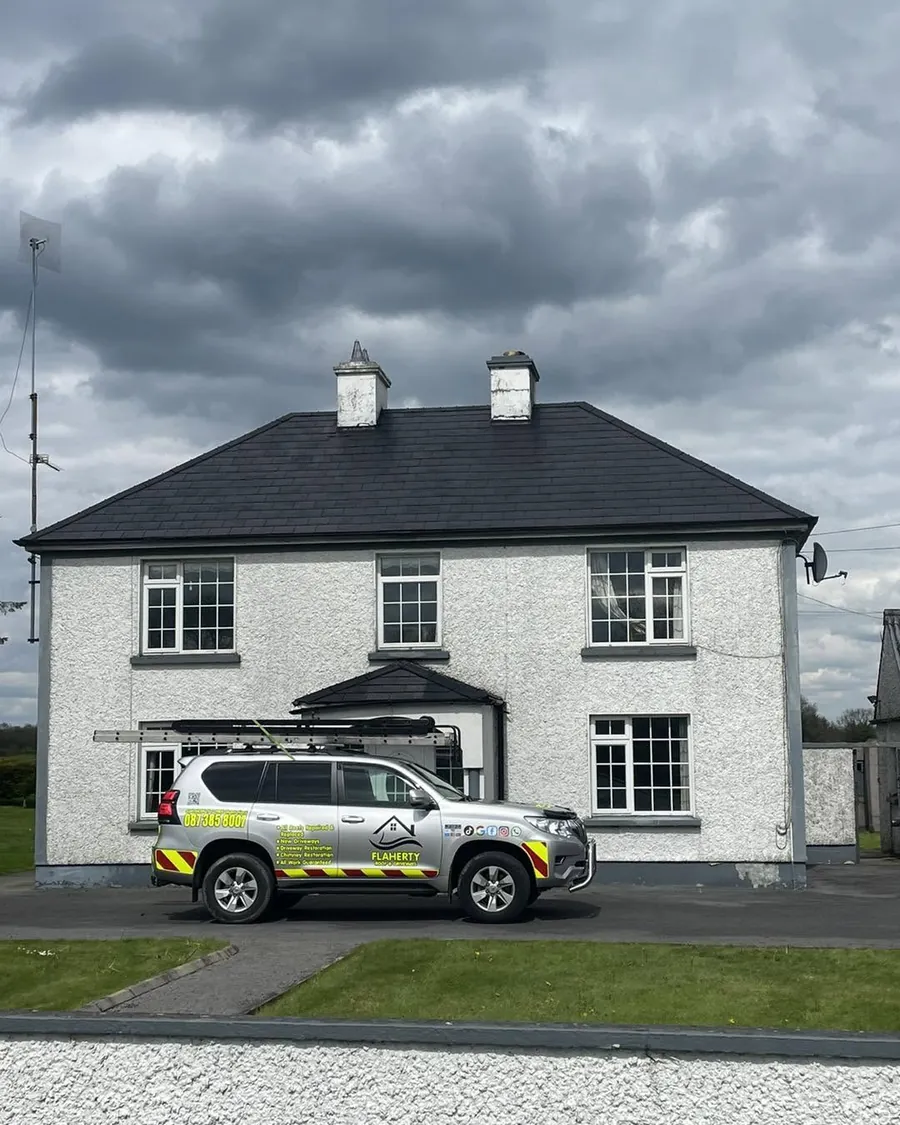 Two-storey house with its roof cleaned and re-coloured and the Flaherty 4x4 outside, Flaherty Roof and Driveways